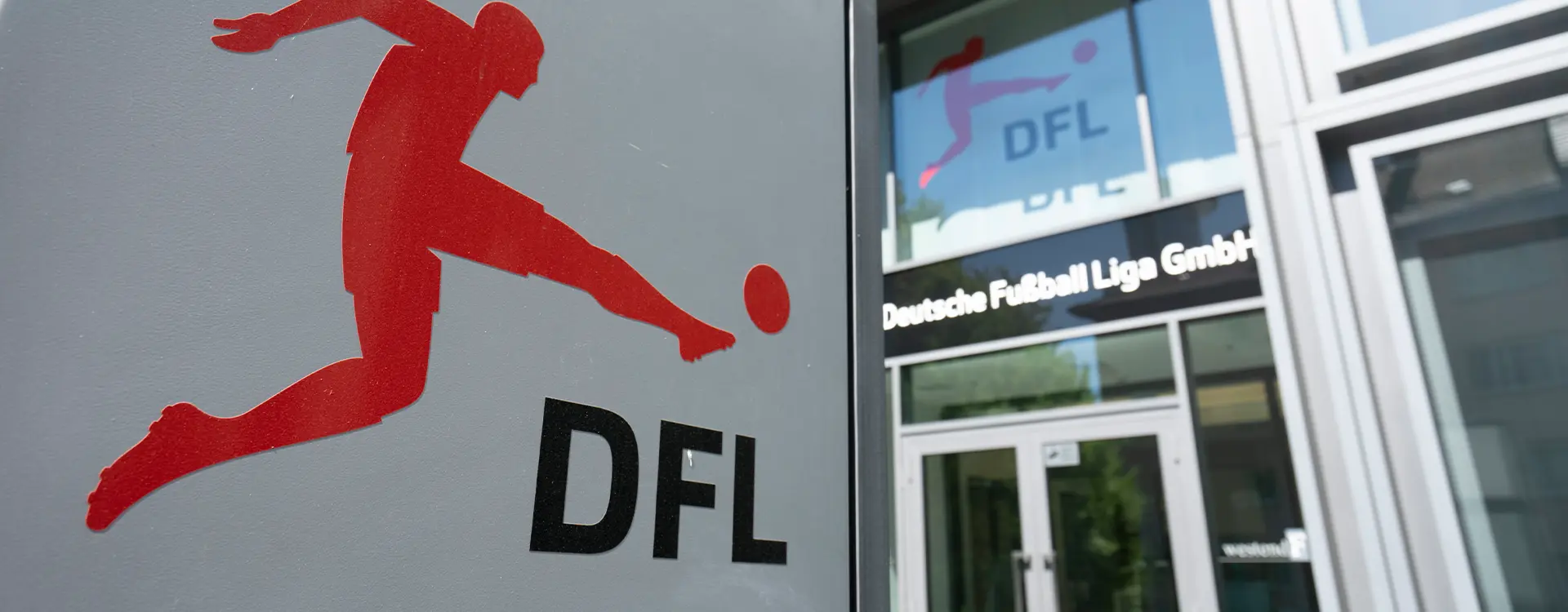 Entry sign with the DFL logo and a glass entryway visible to the office in the background. (Photo)