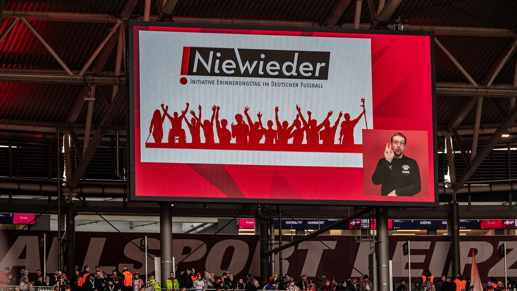 Matchday 19: RB Leipzig - Bayer 04 Leverkusen shows an indoor stadium setting with a large screen displaying text that reads "nieweider,". (Photo)