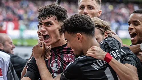 1. FC Nürnberg players celebrating after a goal.&nbsp;&nbsp; (Photo)